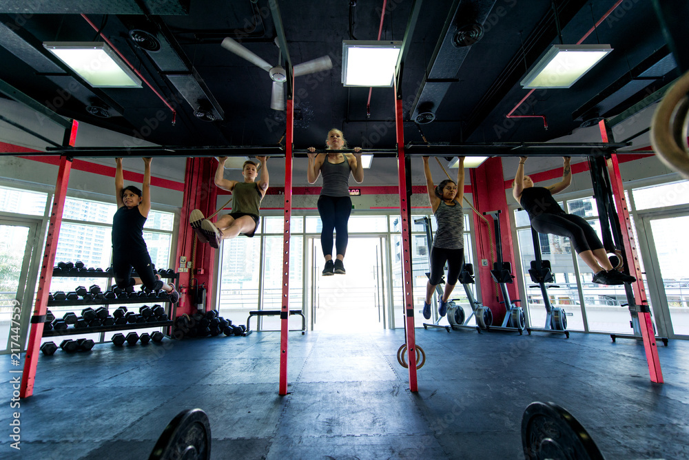 Fototapeta premium Athletes training in a cross-fit gym