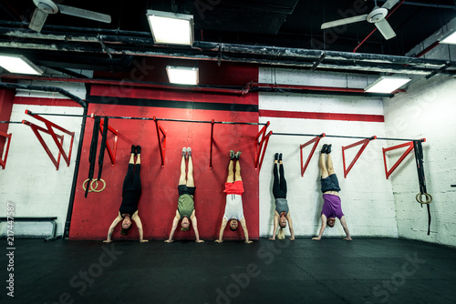 Athletes training in a cross-fit gym photo