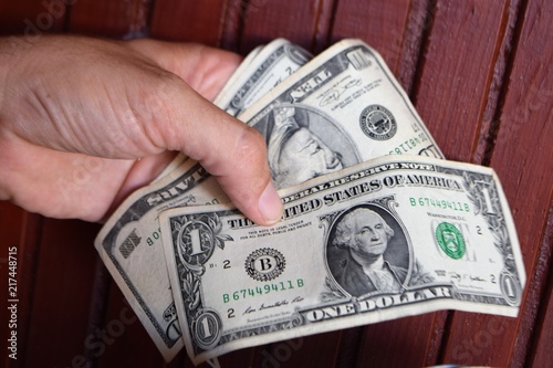 man hands dollar and Turkish lira