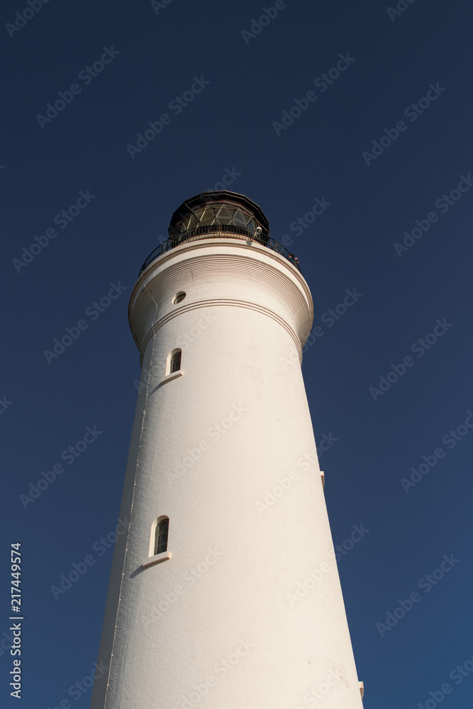 White Lighthouse with sun reflection and lens flare, Hirtshals Fyr in Hirtshals, North Jutland in Denmark, Europe White Lighthouse with sun reflection and lens flare, Hirtshals Fyr in Hirtshals, North Jutland in Denmark, Europe