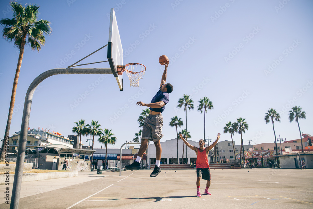 Fototapeta premium Friends playing basketball