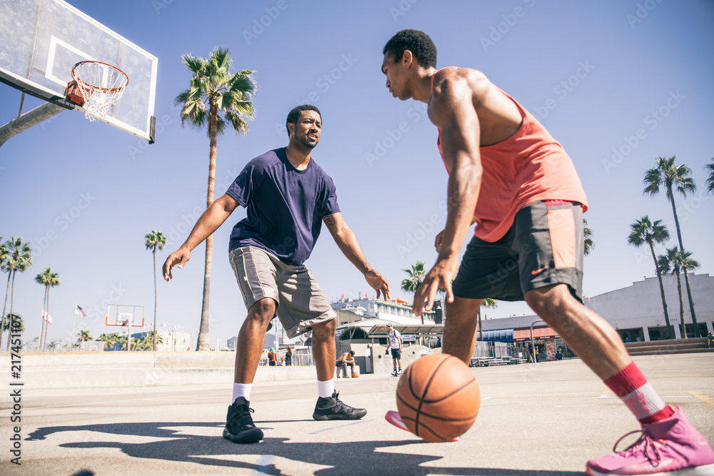 Fototapeta premium Friends playing basketball