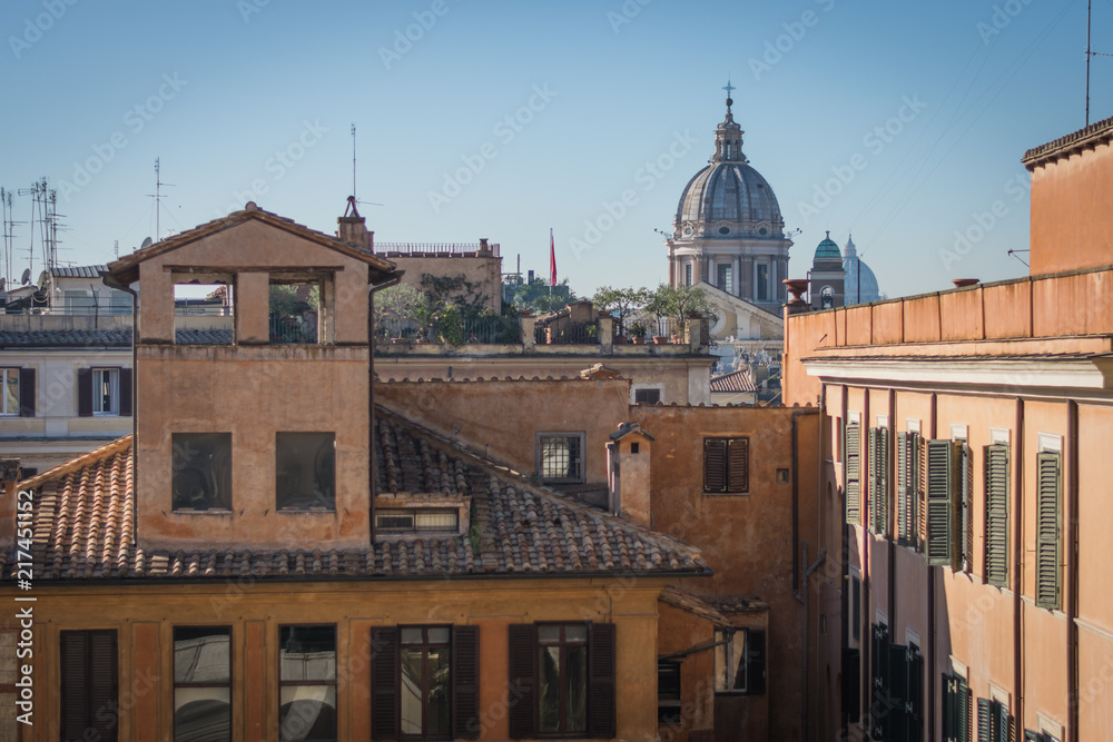 The domes and rooftops of the eternal city, the view from the Spanish steps, Rome, Italy, sunny day and blue sky

