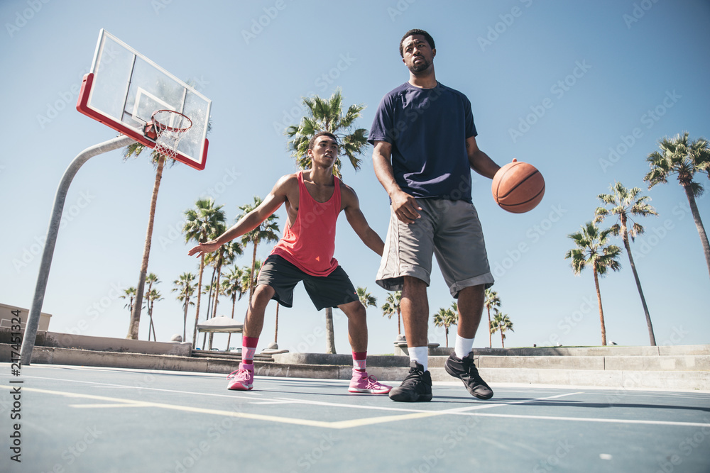 Fototapeta premium Friends playing basketball