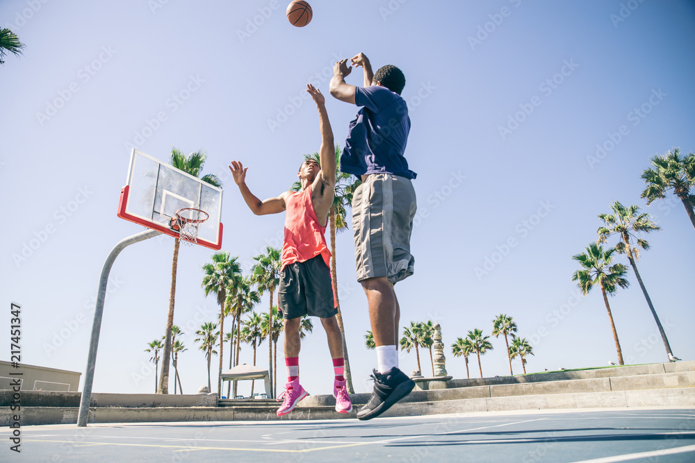 Fototapeta premium Friends playing basketball