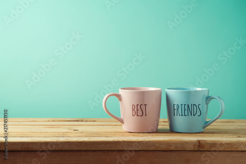 Coffee cups on wooden table