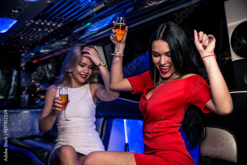 Girls partying in a limousine photo