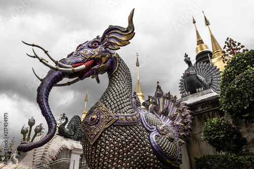 Amazing Elephant Divinity and Himmapan Mythical Creature with dramatic sky at Wat Bandensali buddhist temple in Thailand photo