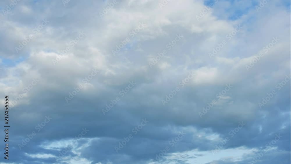 Time lapse of the serene blue sky is adorned with puffy, fluffy white clouds, creating a mesmerizing cumulus cloud cloudscape. Time lapse of the serene blue sky is adorned with puffy, fluffy white clouds, creating a mesmerizing cumulus cloud cloudscape.