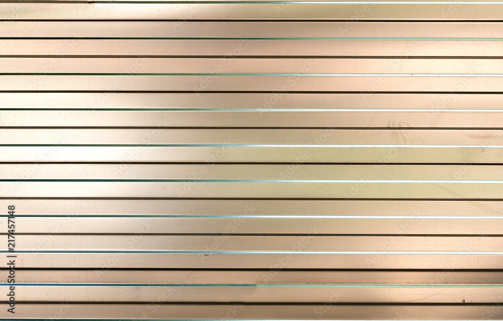 Texture of a sheet of ribbed metal. Reflective background Texture of a sheet of ribbed metal. Reflective background