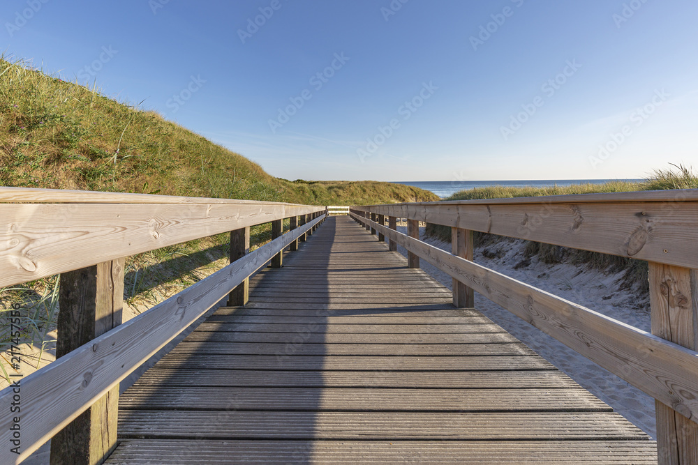 Wooden Boardwalk at Sylt-Wenningstedt in between the Dunes / Germany