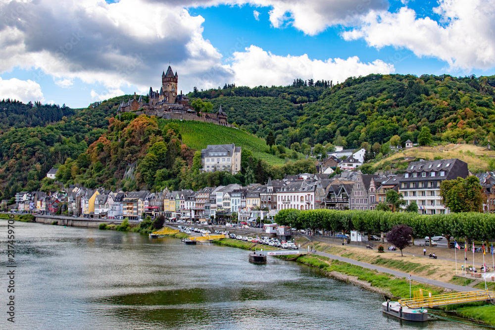 View on the city of cochem and the beautiful castle on top of a hill in summer