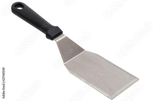 A silver spatula angled diagonally