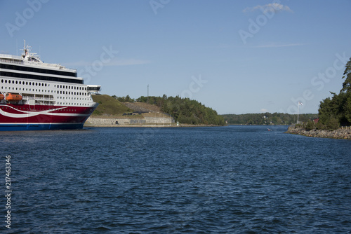 Ferry passes Oskar Fredriksborg at Rindö, Stockholm, Sweden © Hans Baath