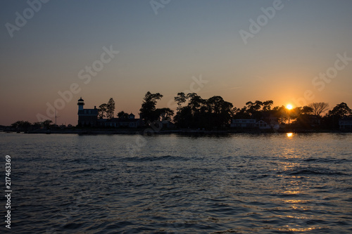 Sunset over entrance to harbor near Noank Connecticut photo
