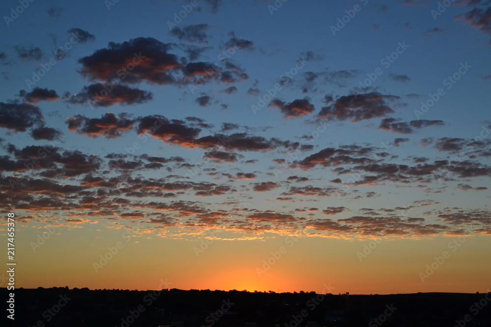 sunrise with clouds, orange and blue sky