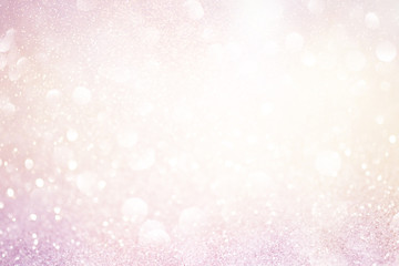 pale pink glittering christmas lights. Blurred abstract background