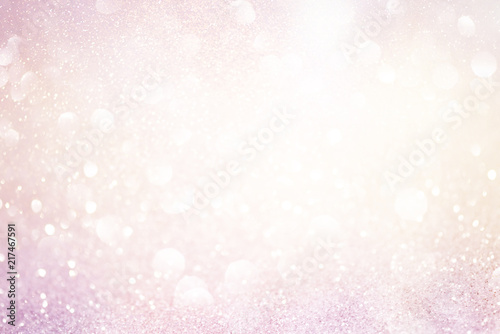 pale pink glittering christmas lights. Blurred abstract background
