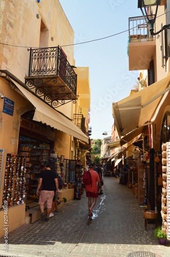 Fototapeta Naklejka Na Ścianę i Meble -  Narrow Streets In The Venetian Style Neighborhood Of Chania Repeltas Souvenir Shops. History Architecture Travel. July 6, 2018. Chania, Crete Island. Greece.