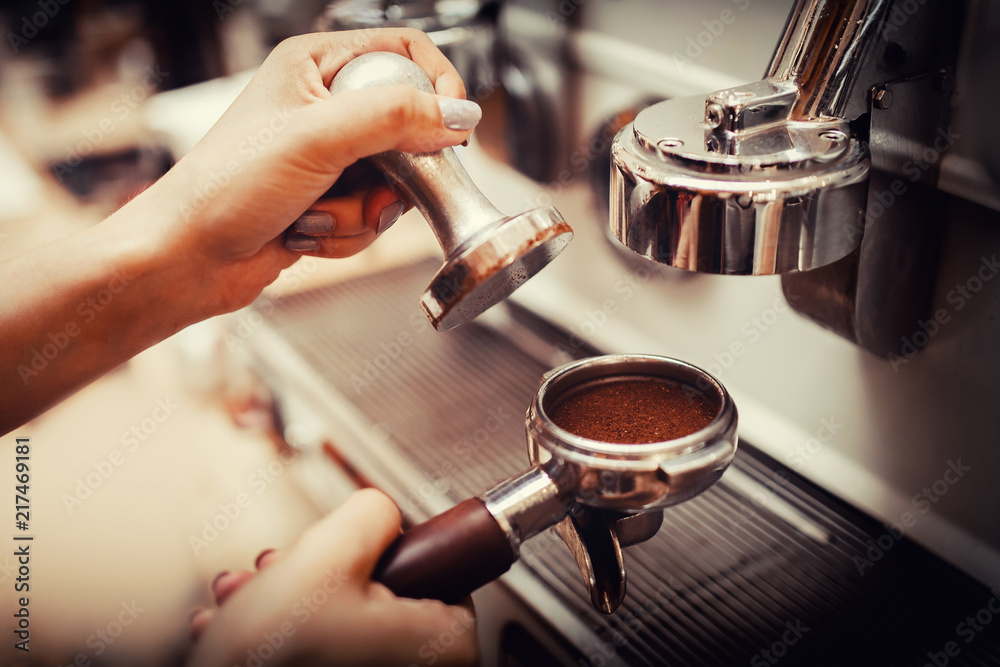 Young barista woman is preparing coffee machine Tamper Filter holder Young barista woman is preparing coffee machine Tamper Filter holder