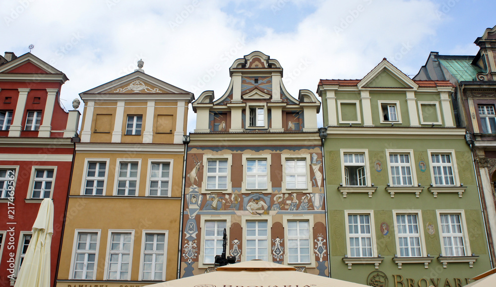 Poznan, Poland - 04/11/2014 - view of street in old town with colorful houses, market square, sunny day