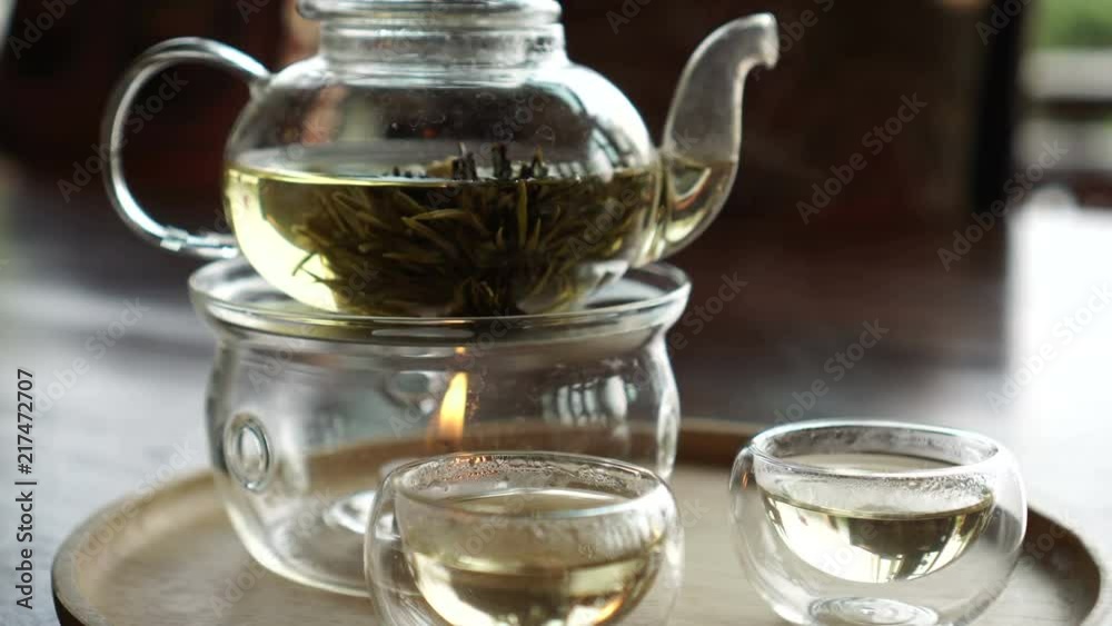 Beautiful flower tea serve in glass pot and cup video Beautiful flower tea serve in glass pot and cup video