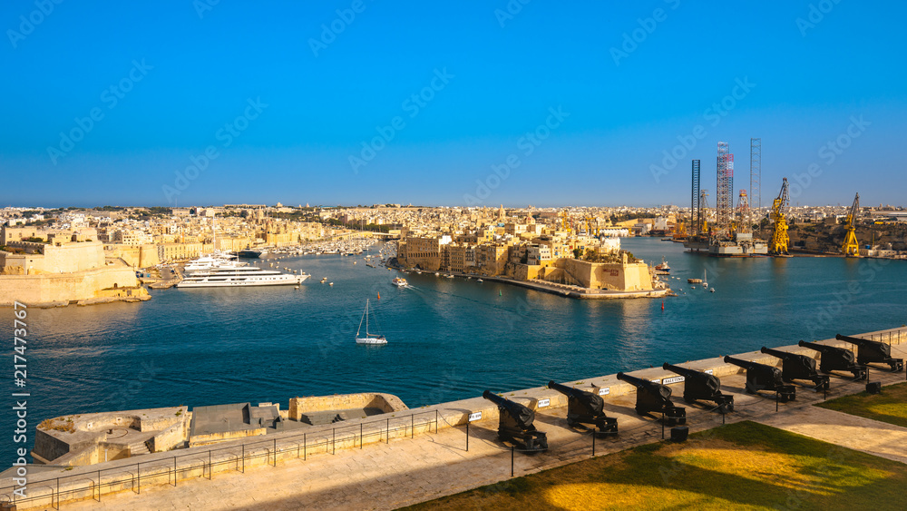 Malta valletta panoramic view with harbour and luxury yacht at sunset