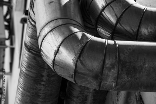 Fényképezés Black and white industrial ventilation pipe is close