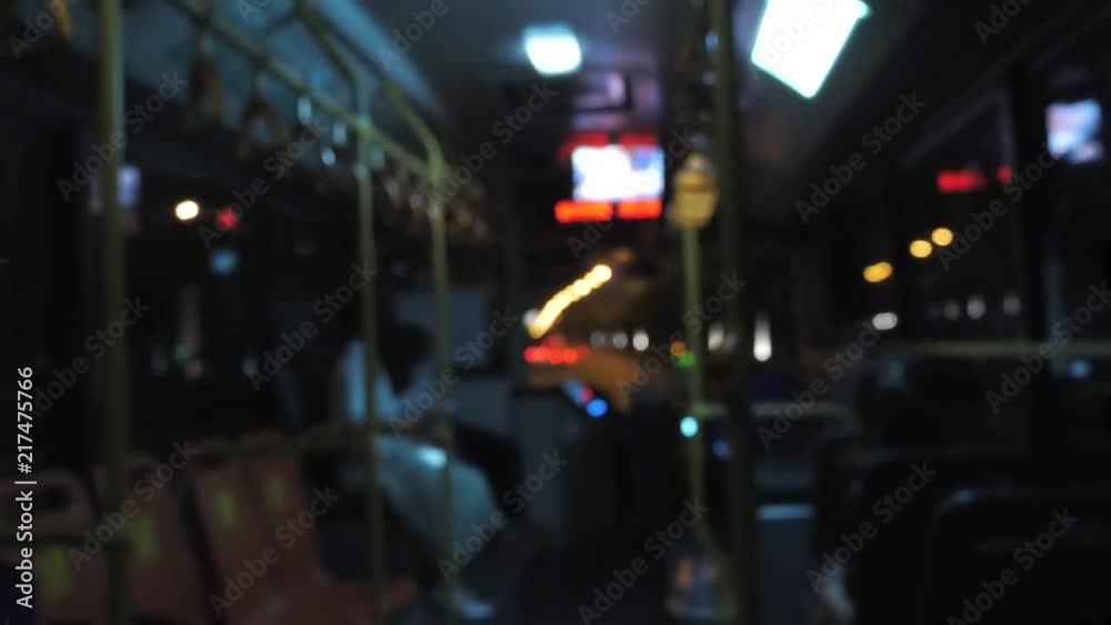 Blured inside view of bus at night. Traveling on road by bus in the evening hours Blured inside view of bus at night. Traveling on road by bus in the evening hours