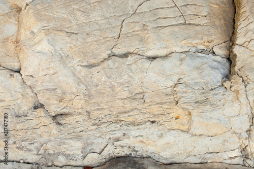 Texture of layered stone in mountainous terrain