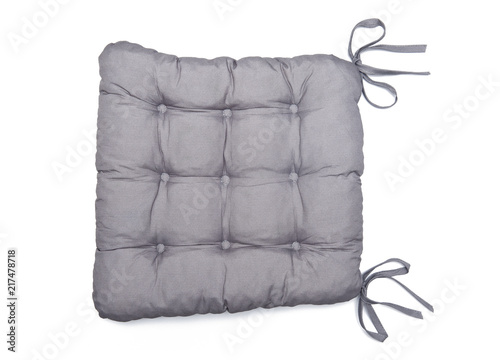 Grey chair pad with buttoned detail isolated on the white background 