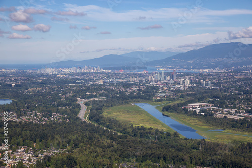 Aerial view of Burnaby Lake in the City with Downtown in the background. Taken in Vancouver, British Columbia, Canada.