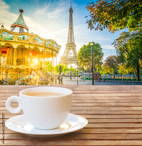 cup of coffee with view of Eiffel Tower with merry go round from Trocadero at sunrise  Paris  France