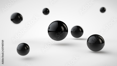 the image of groups of balls with different depth of field, black drop-shadow, and randomly located in space, and one black, a large ball in the center, on a white background. 3D rendering.