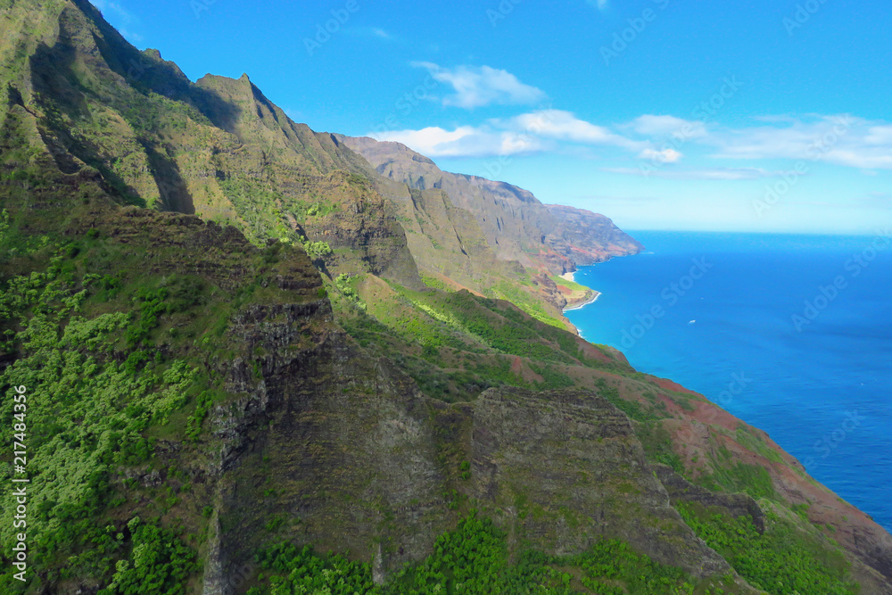 Spectacular aerial view of the sea cliffs at the Na Pali Coast, shot taken from a helicopter, Kauai, Hawaii