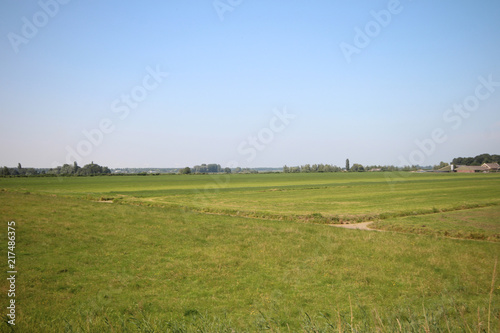 Fields, roads,bicycle lanes and canals along the dyke of the Hollandsche IJssel in Moordrecht, the Netherlands/