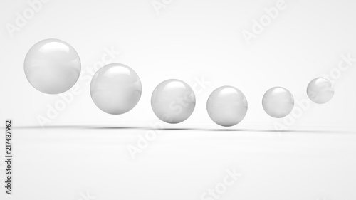Fototapeta Naklejka Na Ścianę i Meble -  The image of the set of balls of various sizes, in white, is positioned in space in order. Image isolated on a white background, the symbol of order and purpose. 3D rendering