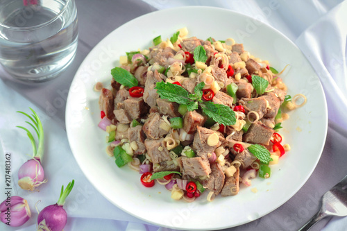 Spicy grilled pork salad with lemon grass and ginger