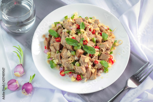 Spicy grilled pork salad with lemon grass and ginger