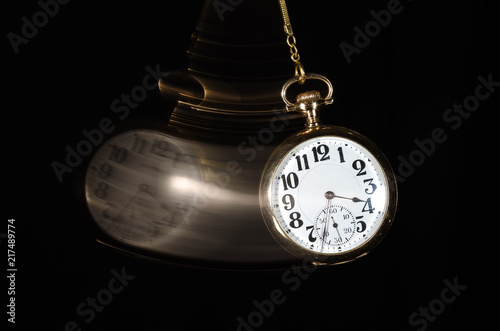 Swinging Pocket Watch Beckoning You to Look More Closely