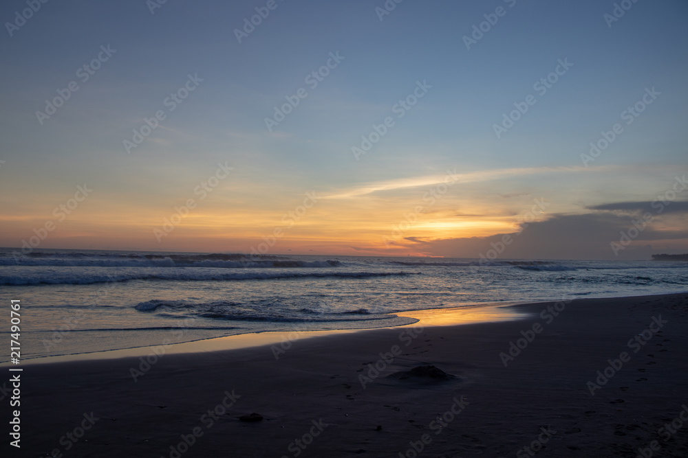 Sunset over sand beach of Changgu area Echo beach,Bali island,Indonesia