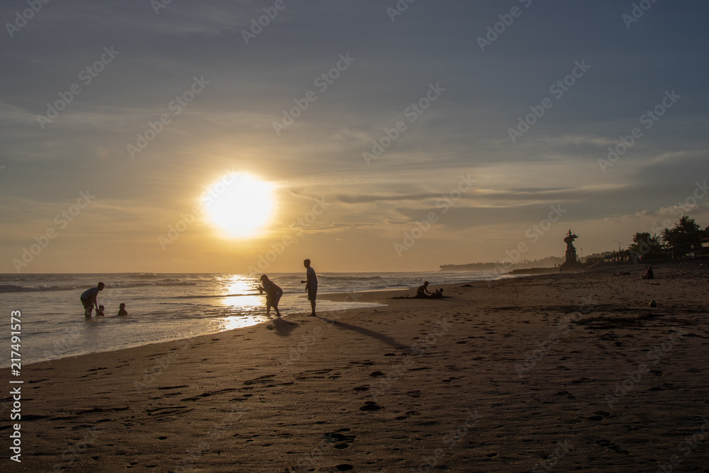 People at Echo Beach in Canggu Bali indonesia at sunset People at Echo Beach in Canggu Bali indonesia at sunset