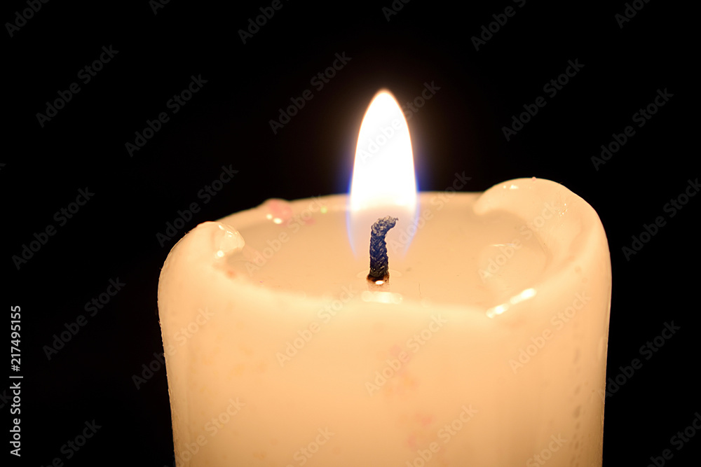 Lit candle with melted wax - Stock Image - C036/0272 - Science Photo Library
