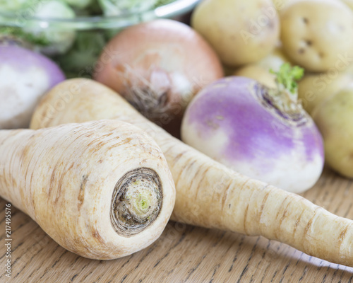 Still life of assorted root vegetables and brussels sprouts. photo