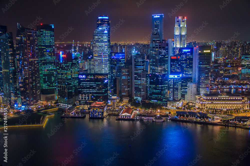Singapore, SINGAPORE, January 19 2014 - Singapore Skyline at Night viewed from Ku De Ta Restaurant in Marina Bay Sands hotel