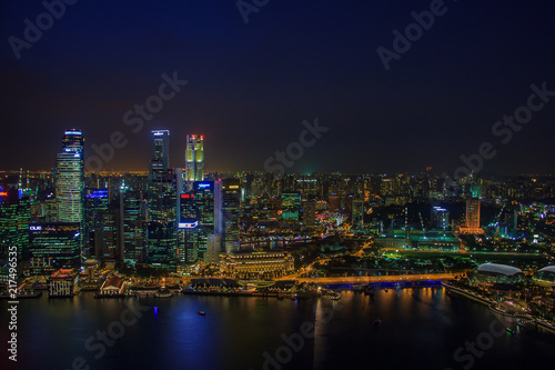 SINGAPORE, January 19 2014 - Singapore Skyline at Night viewed from Ku De Ta Restaurant in Marina Bay Sands hotel