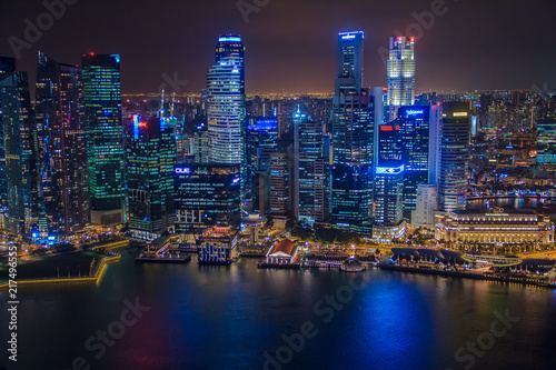 Singapore, SINGAPORE, January 19 2014 - Singapore Skyline at Night viewed from Ku De Ta Restaurant in Marina Bay Sands hotel