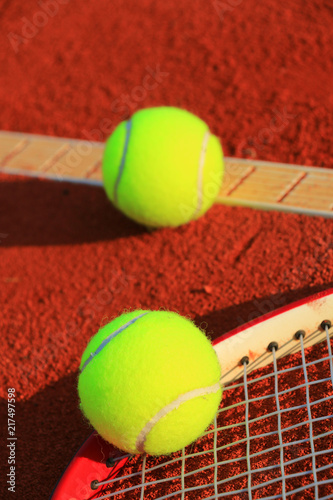 Tennis balls on a tennis clay court