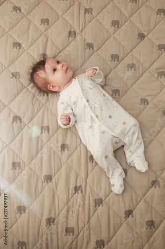 
Adorable two months old baby in the bed