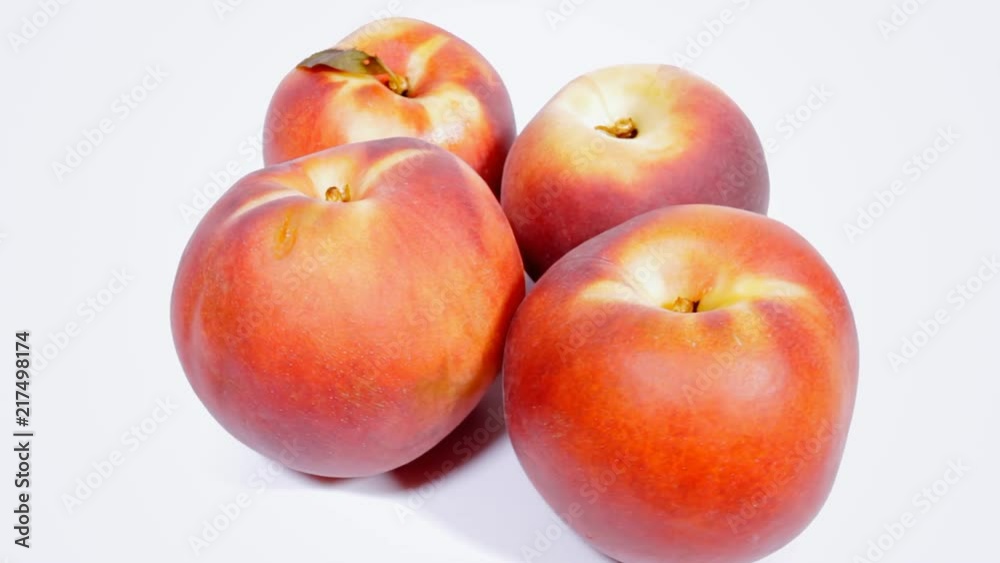 A group of ripe peaches on a rotating surface. Above shot.
A group of ripe peaches on a rotating surface. Above shot.